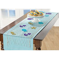 Merihenkinen kattaus-setti, kalaverkko ja pöytäkoristeet.