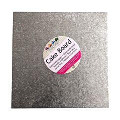 Neliömäinen hopeinen kimalteleva kakkualusta.