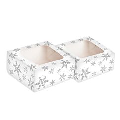 Valkoiset ikkunalliset herkkulaatikot kultaisilla tähdillä.