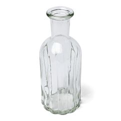 Pieni pyöreä lasinen maljakko.